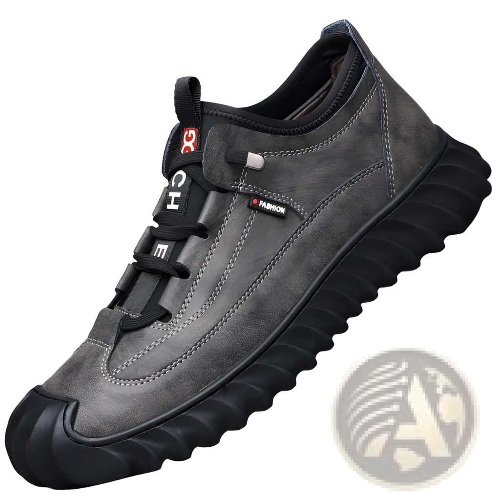 Men’s dark gray suede casual sneaker with black laces, chunky textured rubber sole, and fashion label on the side