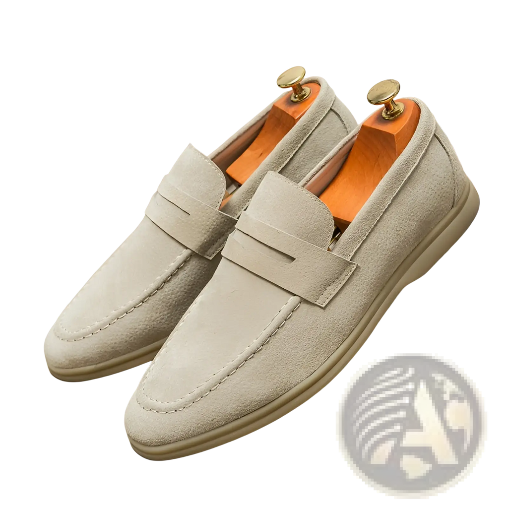 Light gray suede leather men’s loafers with classic slip-on design and contrasting stitching for casual wear