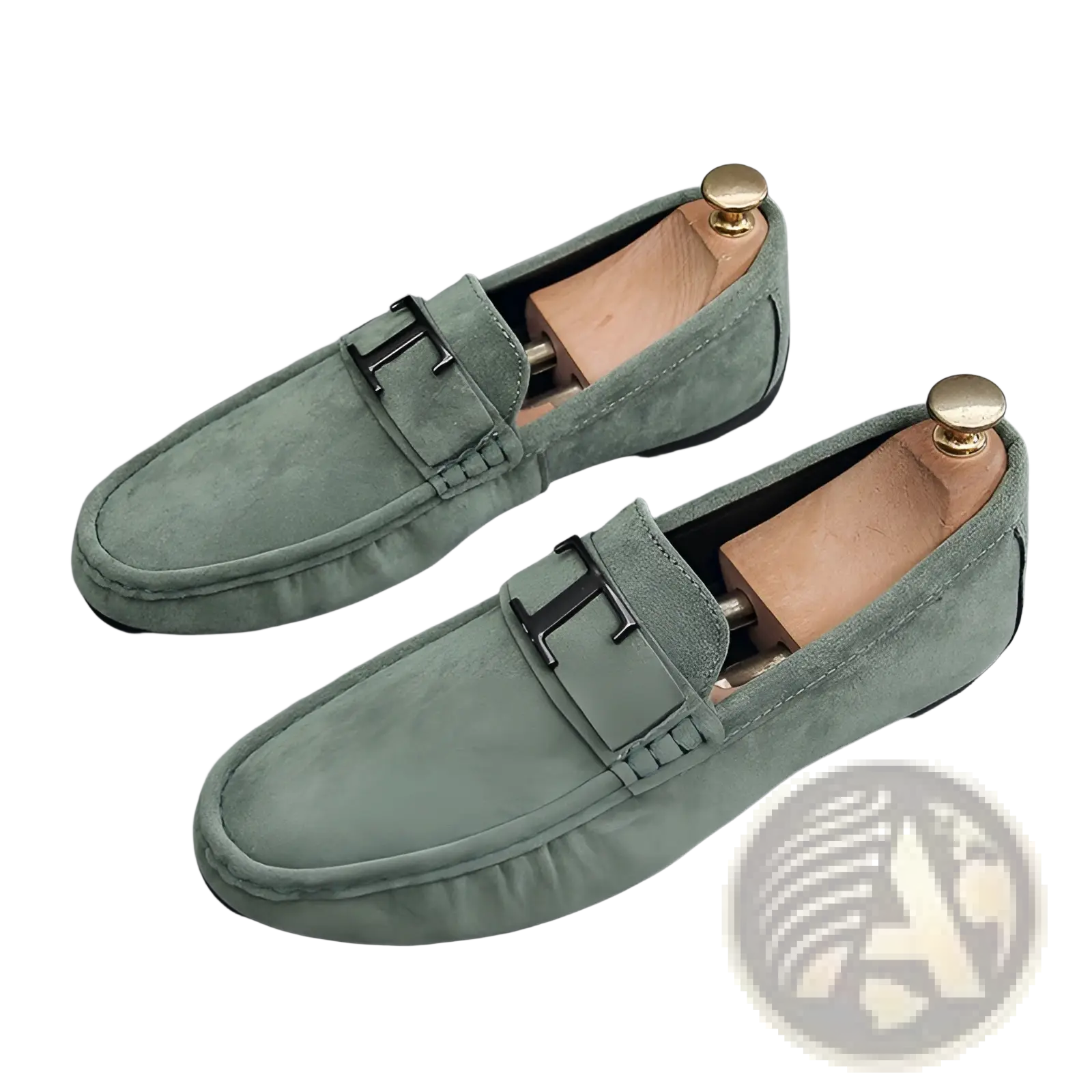 Men’s mint green suede loafers with black h-shaped metal buckle and wooden shoe trees on rubber sole