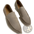 Men’s beige suede slip-on loafers with classic moccasin design and white rubber sole for casual wear