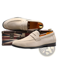 Men’s beige suede penny loafers with classic slip-on design and black rubber soles for casual wear
