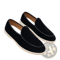 Men’s black suede slip on loafers with white rubber sole and contrasting black stitching for casual wear