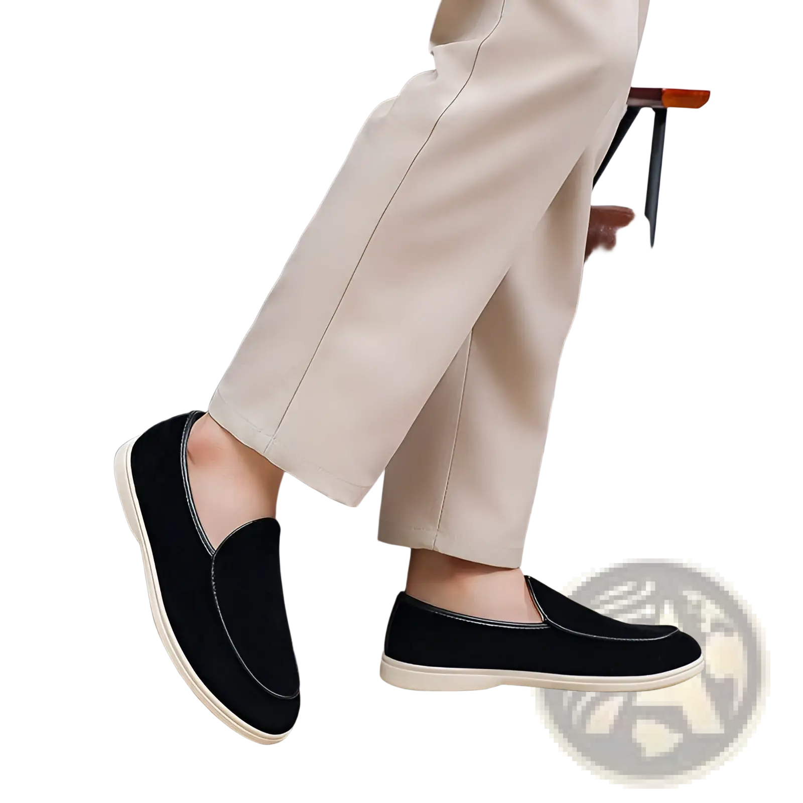 Men’s black suede slip on loafers with white rubber sole and subtle stitching details visible from the side