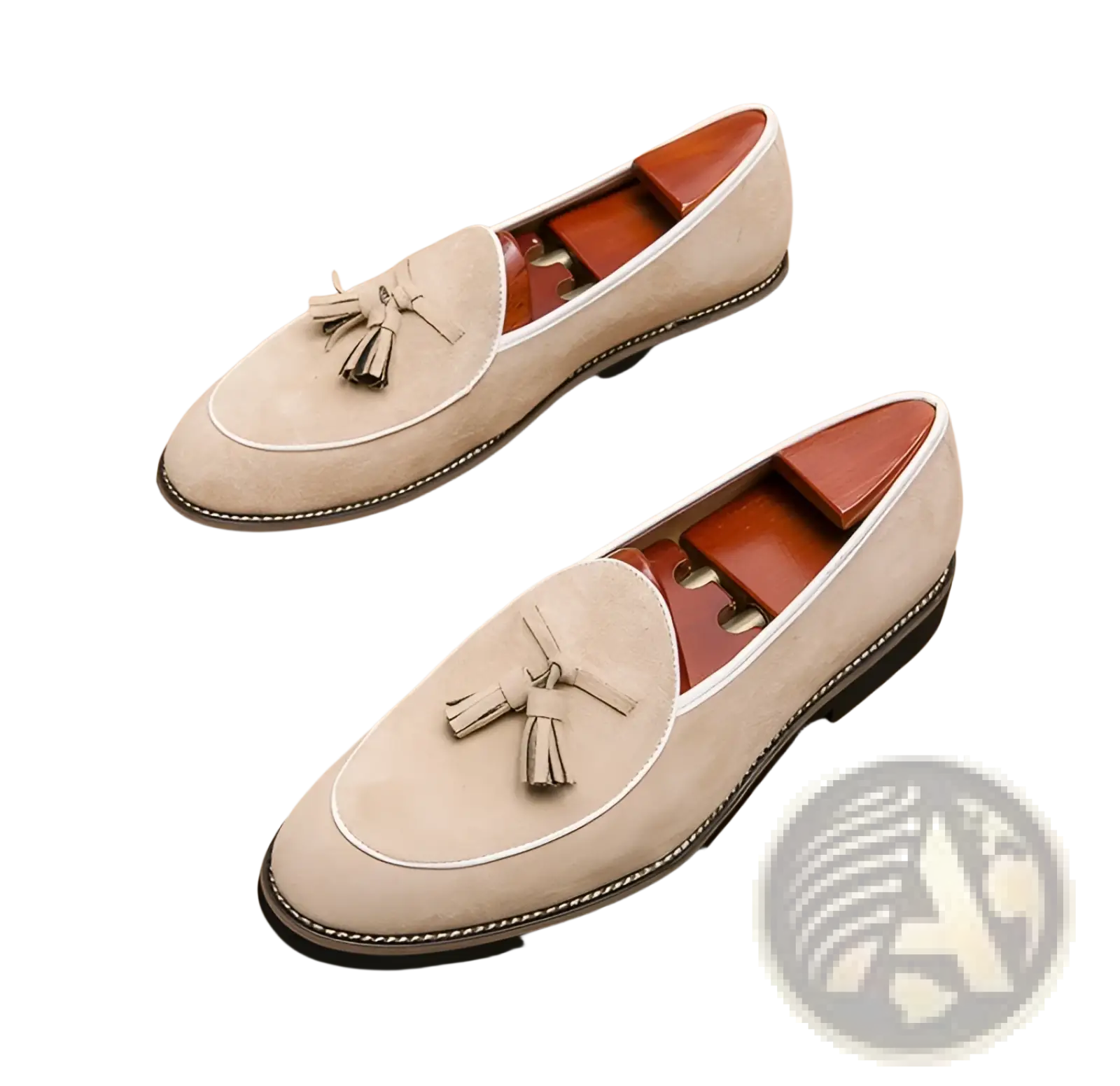 Beige men’s suede tassel loafers with white stitching and black rubber sole made from matte cowhide leather