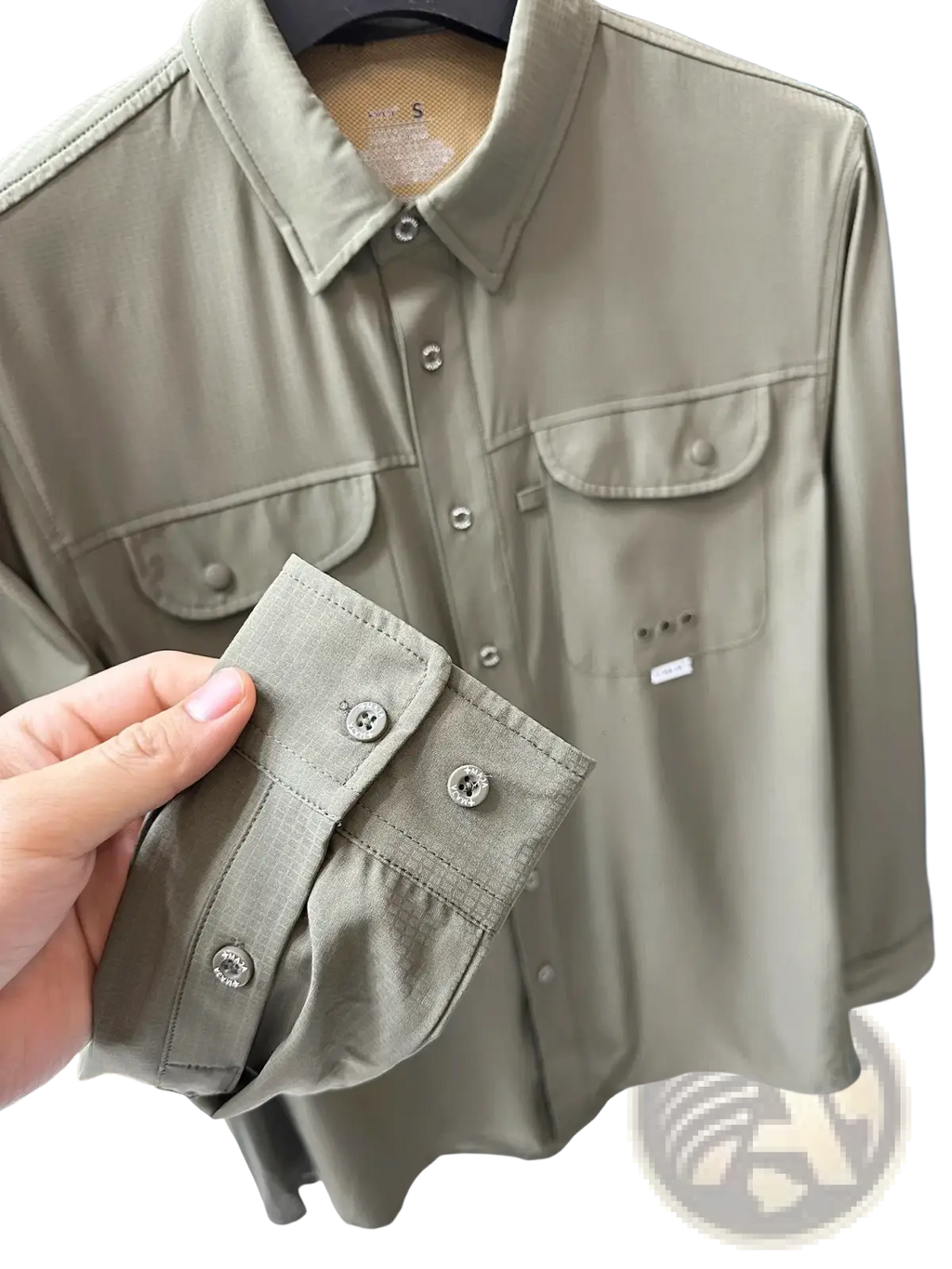 Men’s tactical outdoor long sleeve shirt in khaki with silver buttons and two chest pockets for rugged use
