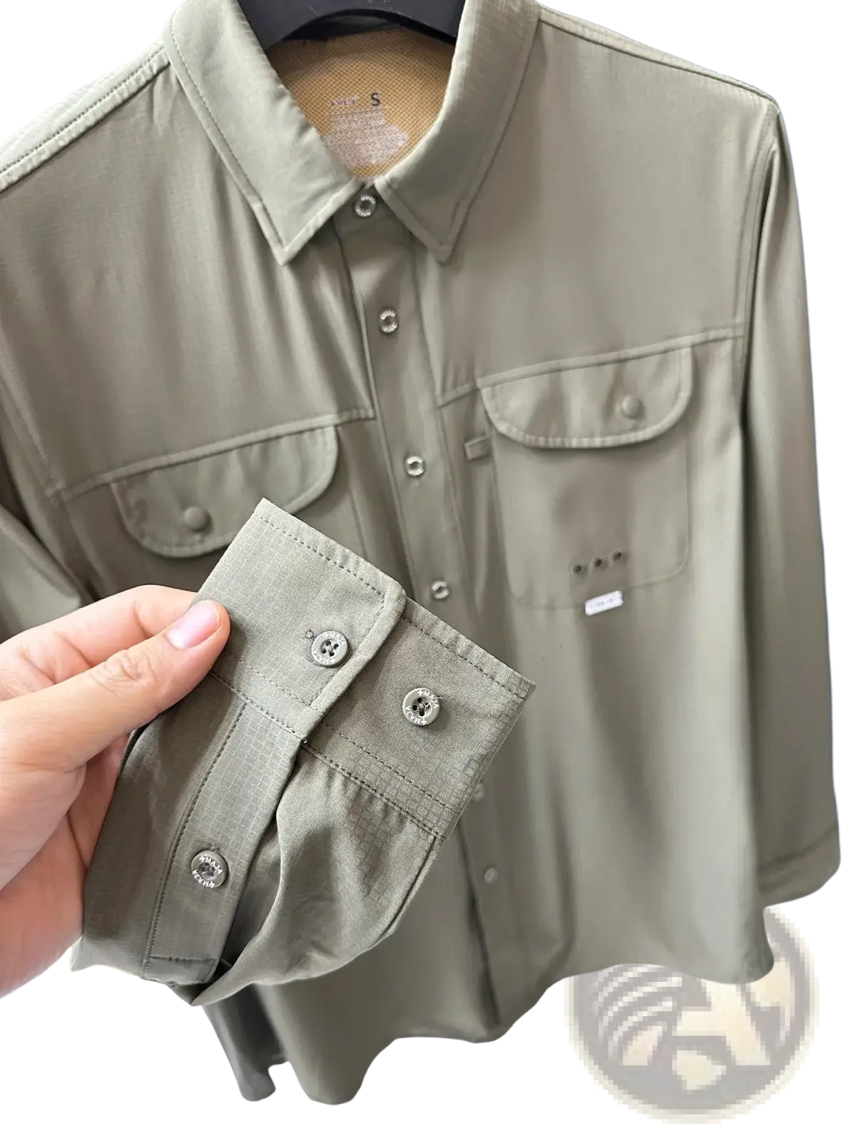 Men’s tactical outdoor long sleeve shirt in khaki with silver buttons and two chest pockets for rugged use