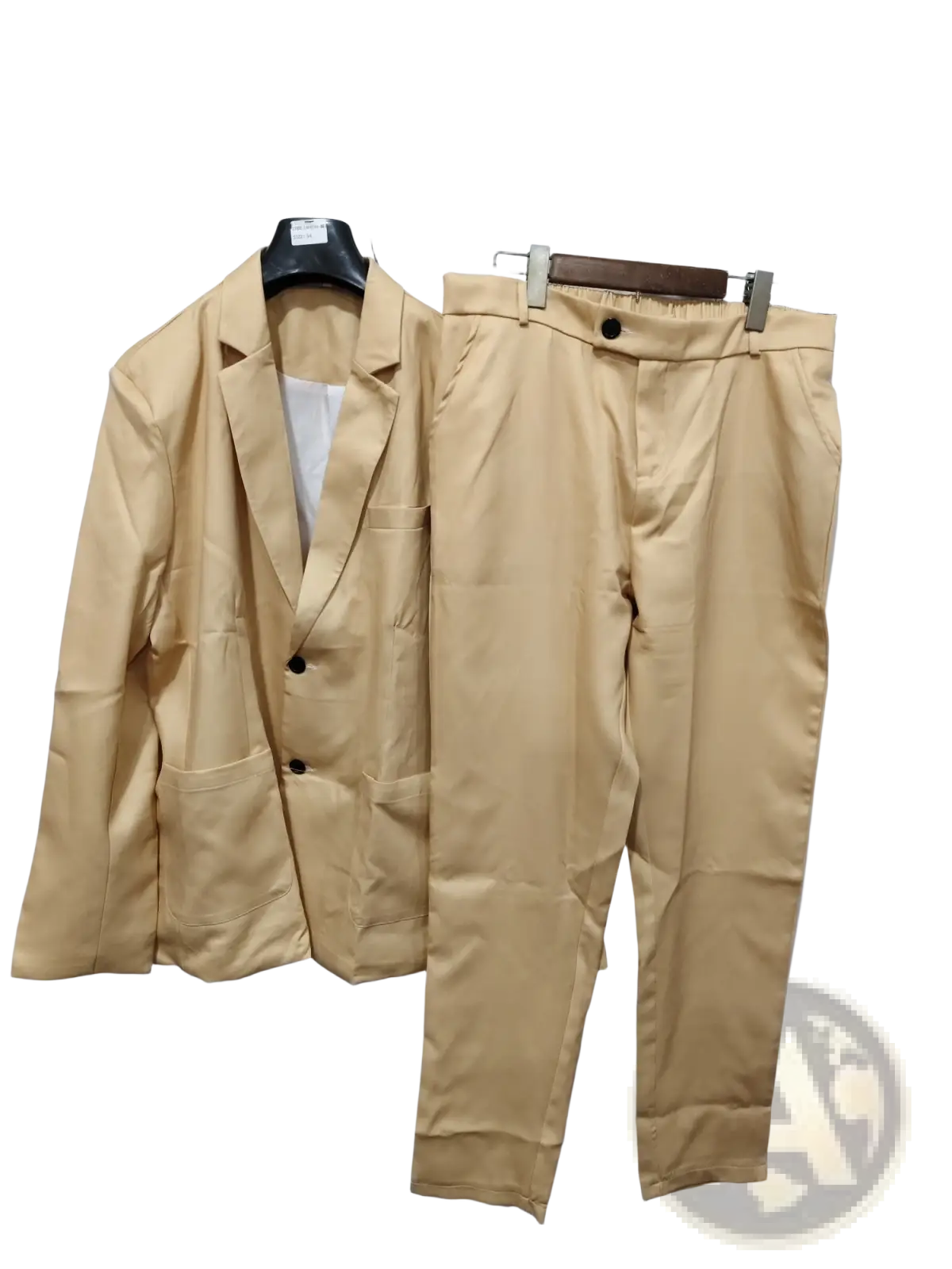 Men’s tailored beige two-piece suit featuring a tan blazer and trousers made of smooth fabric