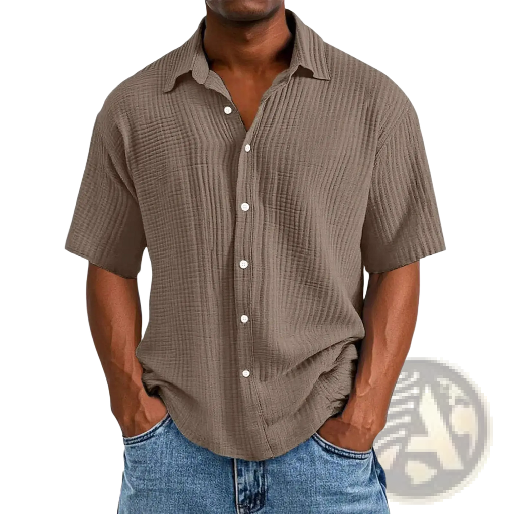 A men’s textured short sleeve button up shirt in muted brown fabric with white buttons and a classic collar