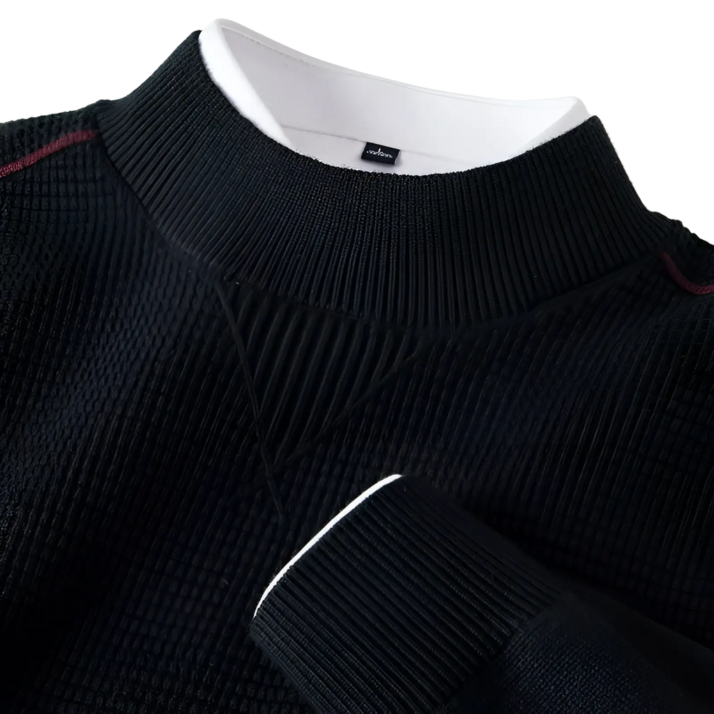 Men’s black textured knit sweater with stand collar ribbed cuffs and white trim along the sleeve edge