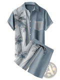 Men’s tropical print short sleeve shirt and shorts set in light blue and white palm tree pattern for casual wear