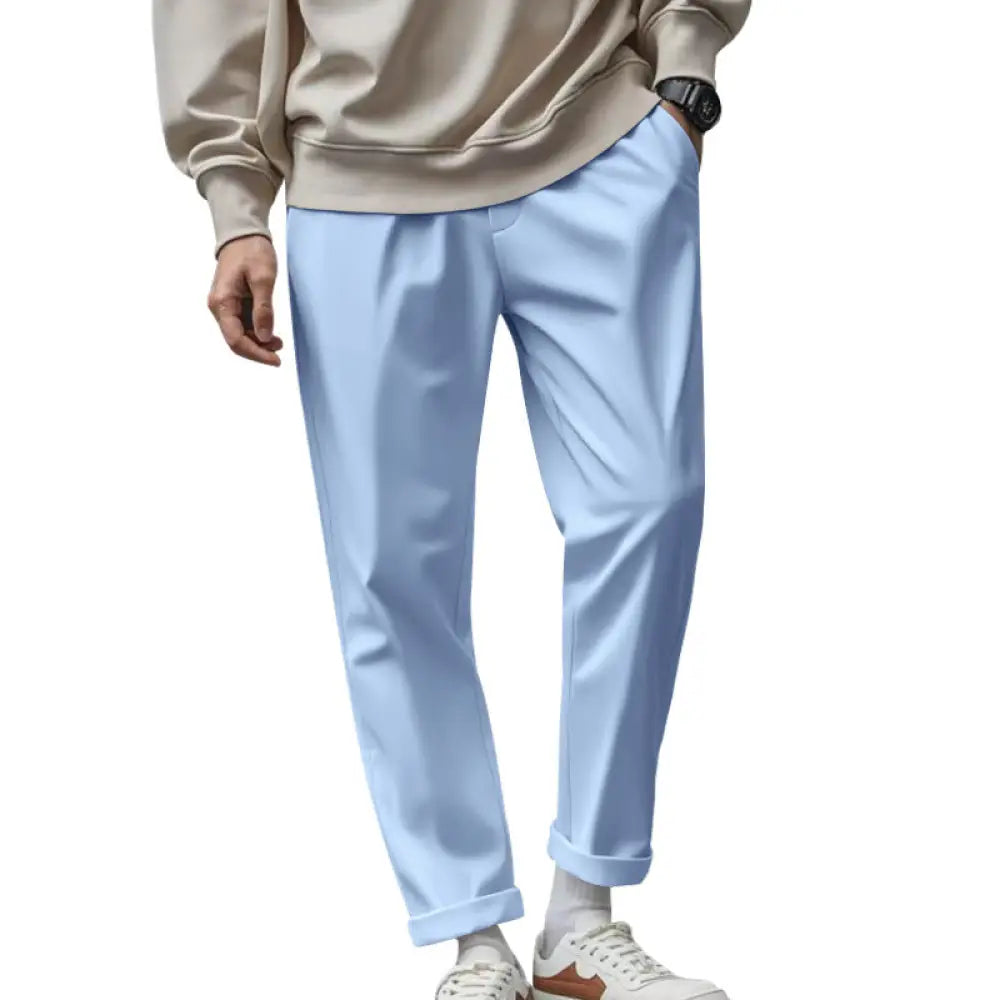 Men’s light blue slim-fit chino pants with rolled cuffs made of lightweight quick dry fabric for relaxed comfort