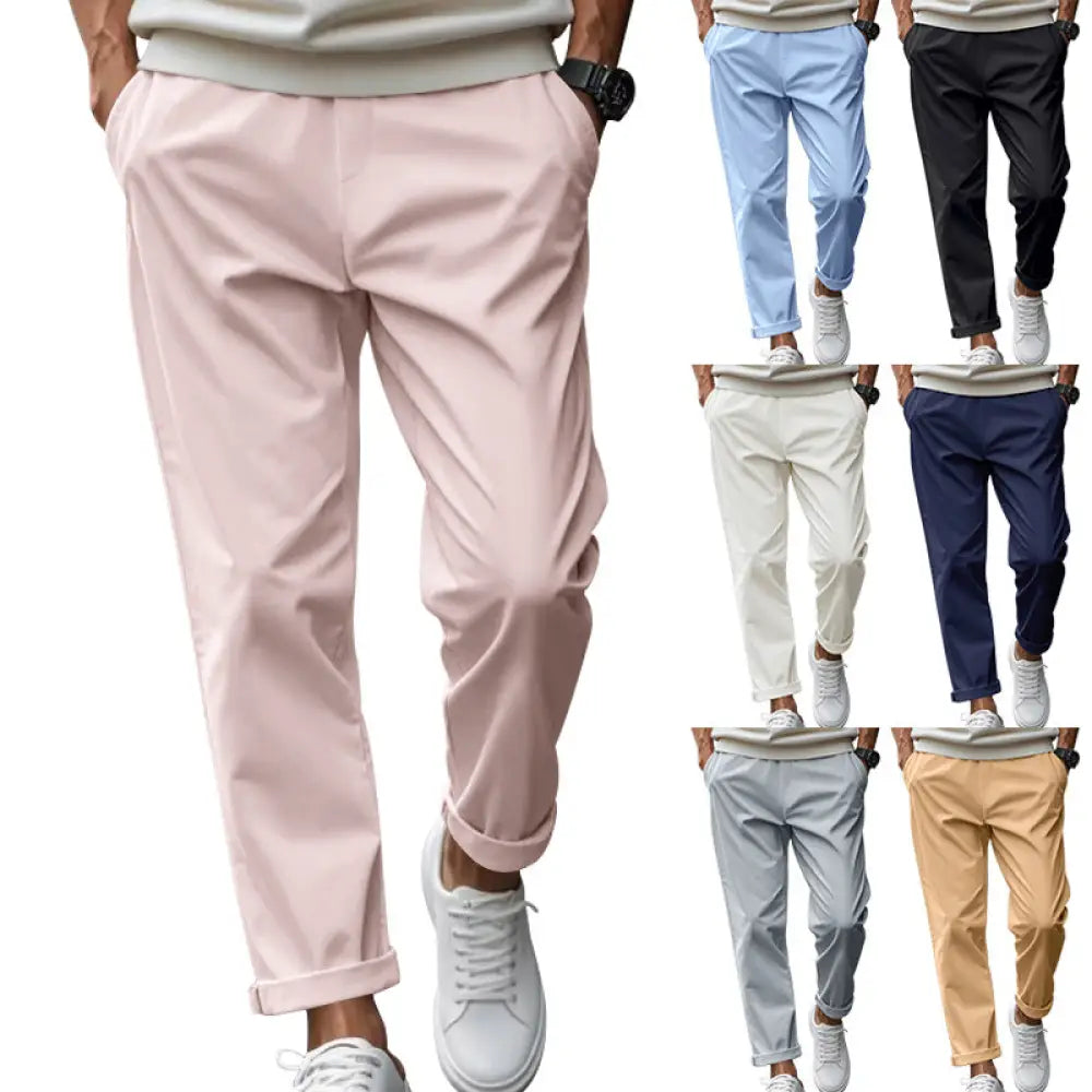 Pastel pink lightweight quick dry tapered chino pants with rolled cuffs and relaxed fit for men