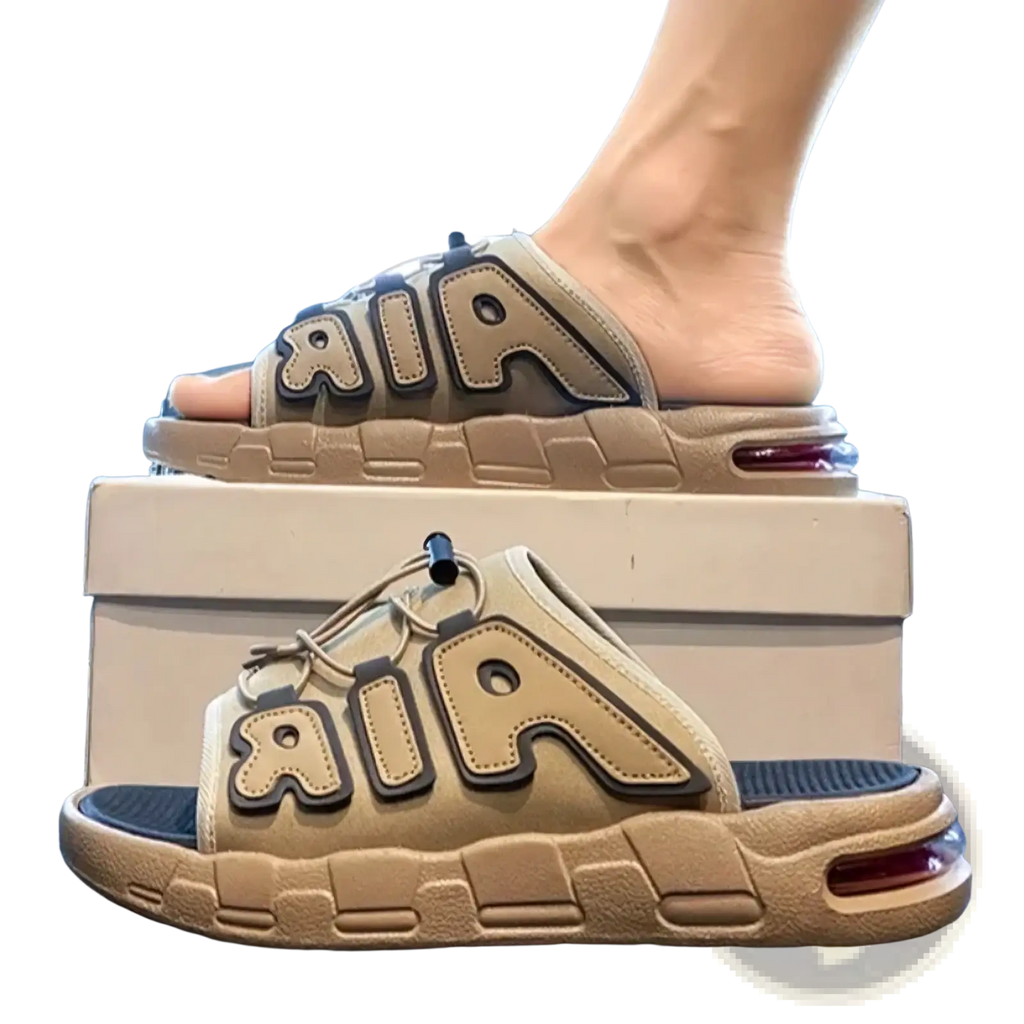Beige Nike air slide sandals with black trimmed air lettering and visible air cushion in sole for men’s ultra soft anti slip use