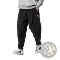Men’s black velvet lined relaxed fit cargo joggers with tapered legs drawstring waist and white logo patch on thigh