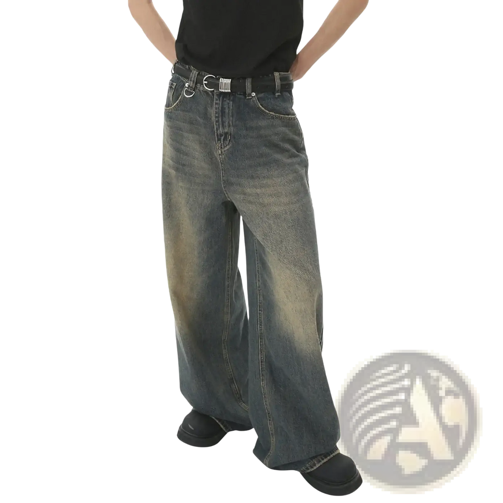 Men’s vintage wide leg baggy denim jeans in faded distressed wash with subtle thigh fading for casual wear