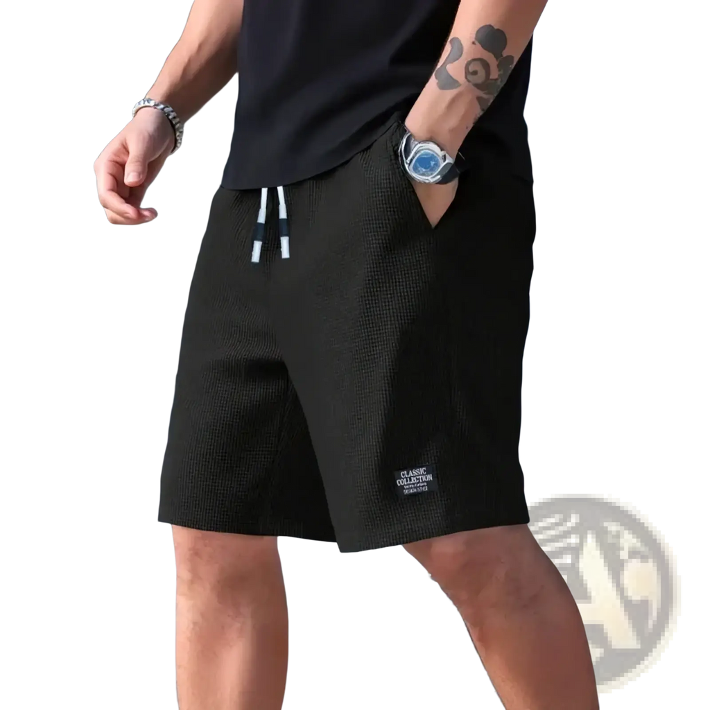 Men’s black waffle knit casual beach shorts with white drawstrings and classic collection label on the lower leg
