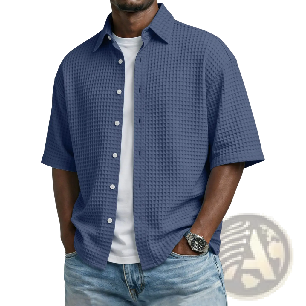 Men’s blue waffle knit short sleeve polo shirt with button-up front and textured fabric ideal for casual wear