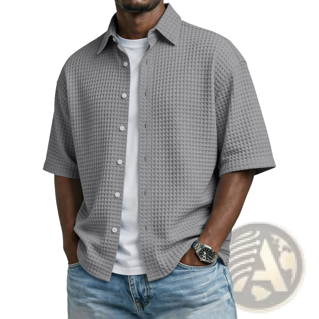 Men’s gray waffle knit short sleeve polo shirt featuring textured fabric and button-up front for casual wear