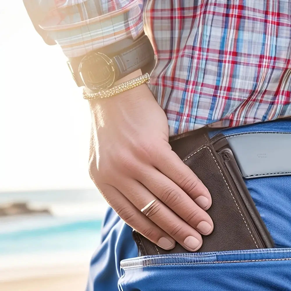 Men’s classic slim stitched leather wallet in brown leather with visible stitching worn in a blue denim pocket