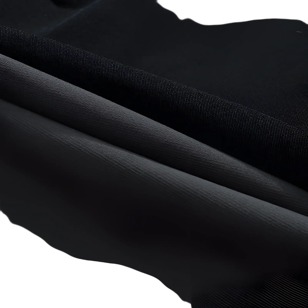 Black satin fabric with a smooth glossy finish used in men’s waterproof tactical hiking pants for durability and style