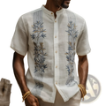 Men’s white linen short-sleeved shirt with intricate blue and gold bamboo embroidery on front panels