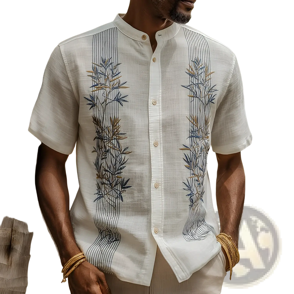 Men’s white linen short-sleeved shirt with intricate blue and gold bamboo embroidery on front panels