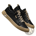 Men’s white minimalist leather casual sneakers in black with beige laces and subtle branding on tongue and side