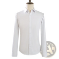 A crisp white mens slim fit long sleeve dress shirt with classic collar and button down front on a mannequin
