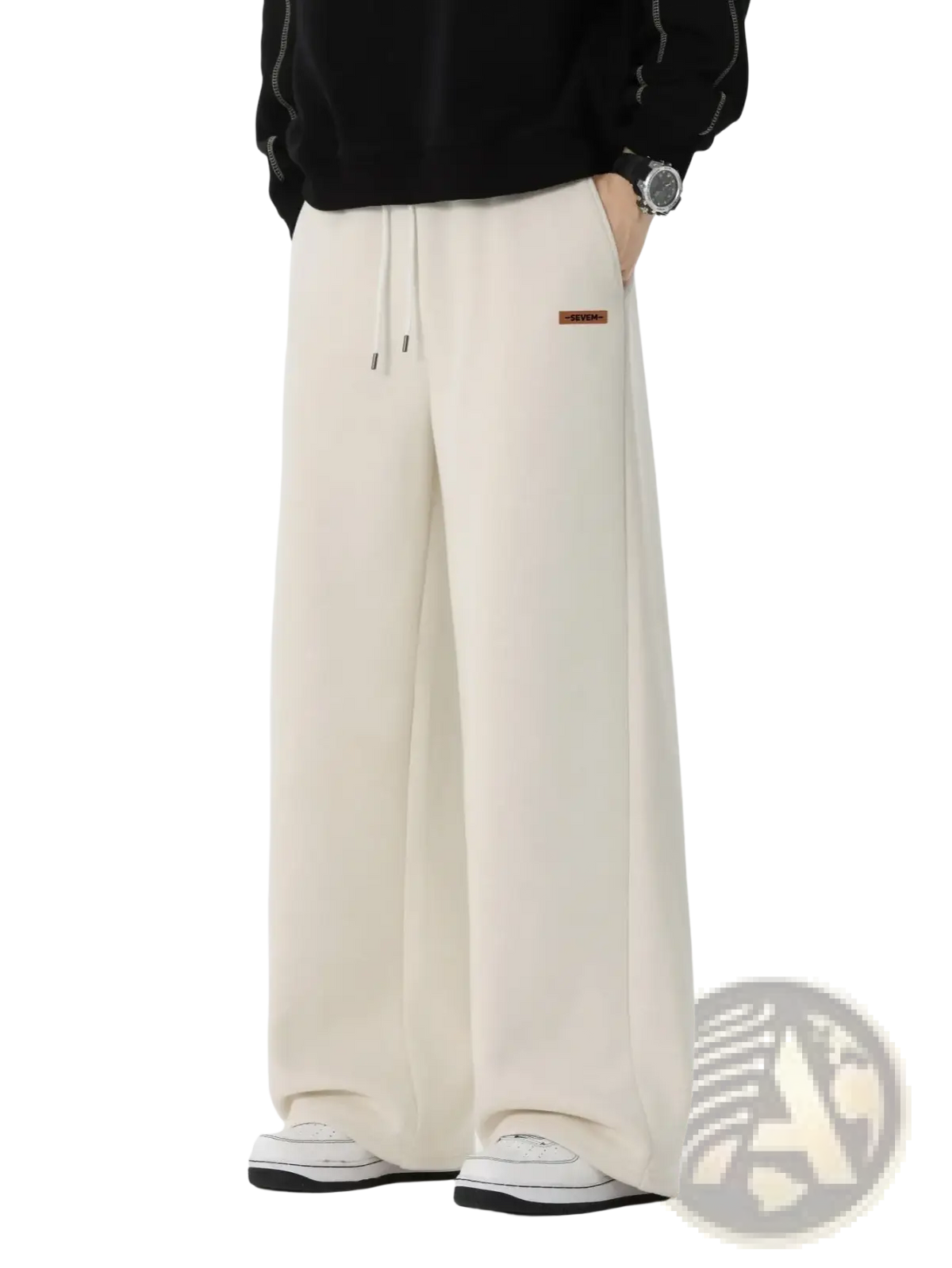 Men’s cream-colored wide leg drawstring sweatpants with a small brand patch on the left thigh for casual wear