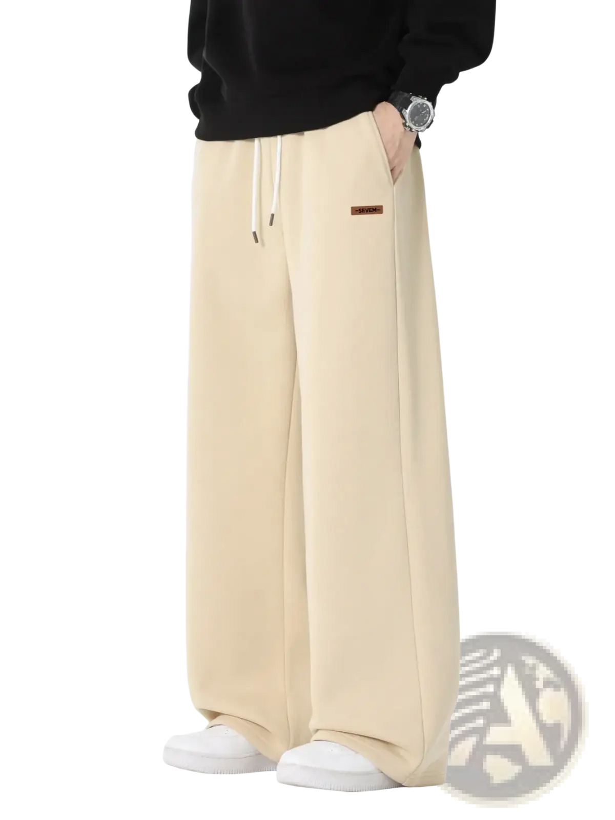 Beige men’s wide leg drawstring sweatpants with white drawstrings and brown brand patch for casual wear