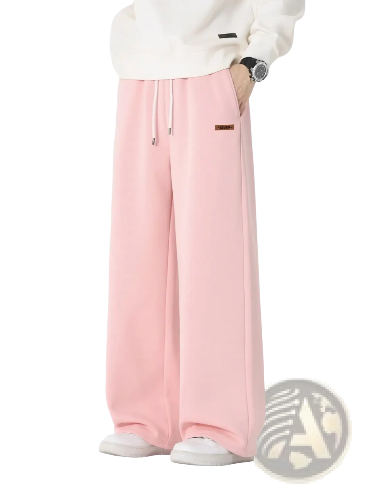 Men’s soft pink wide-leg cotton sweatpants with drawstring waist and brown label on left thigh for casual wear