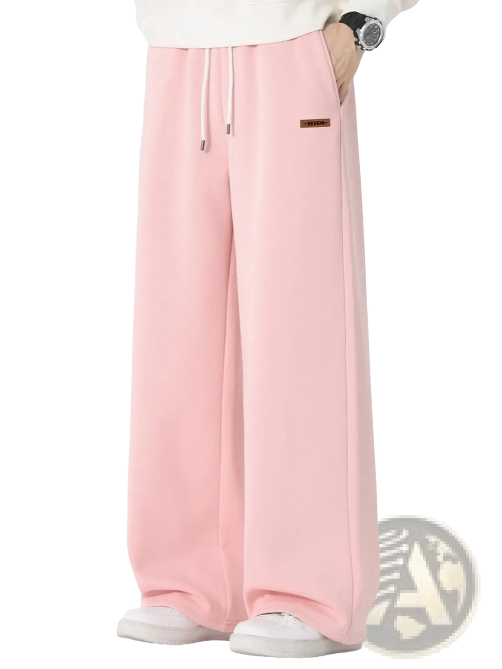 Men’s wide leg drawstring sweatpants in soft pink with a drawstring waist and brown label on the left thigh