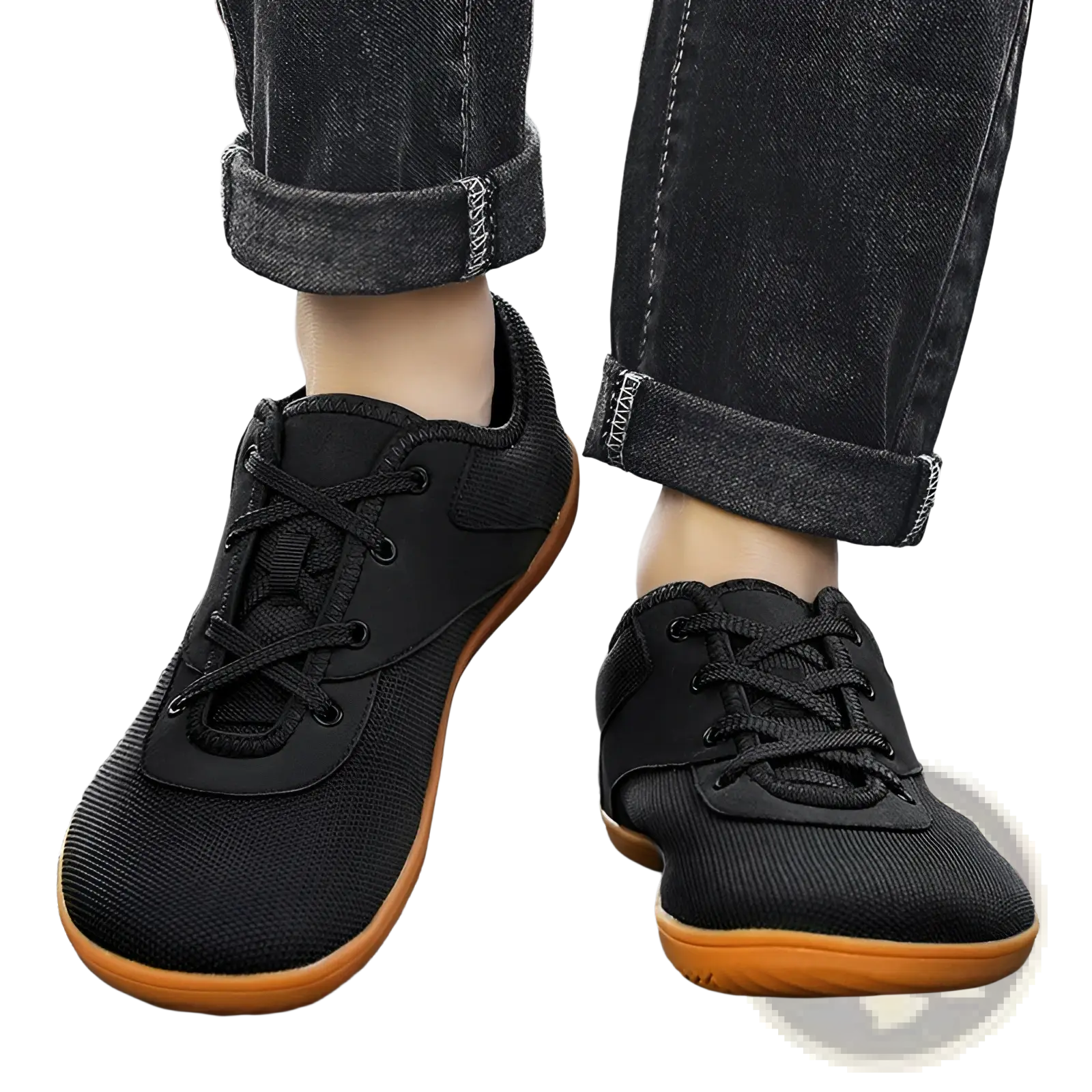 Men’s wide toe breathable mesh running sneakers in black with orange rubber soles and black laces shown from the back