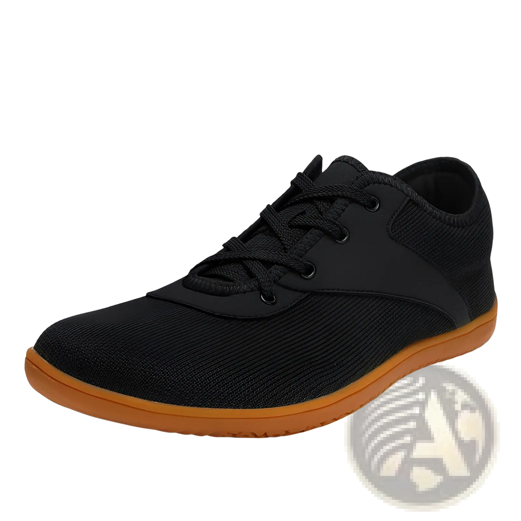 Men’s wide toe breathable mesh running sneaker in black with contrasting orange sole and black laces visible from the back