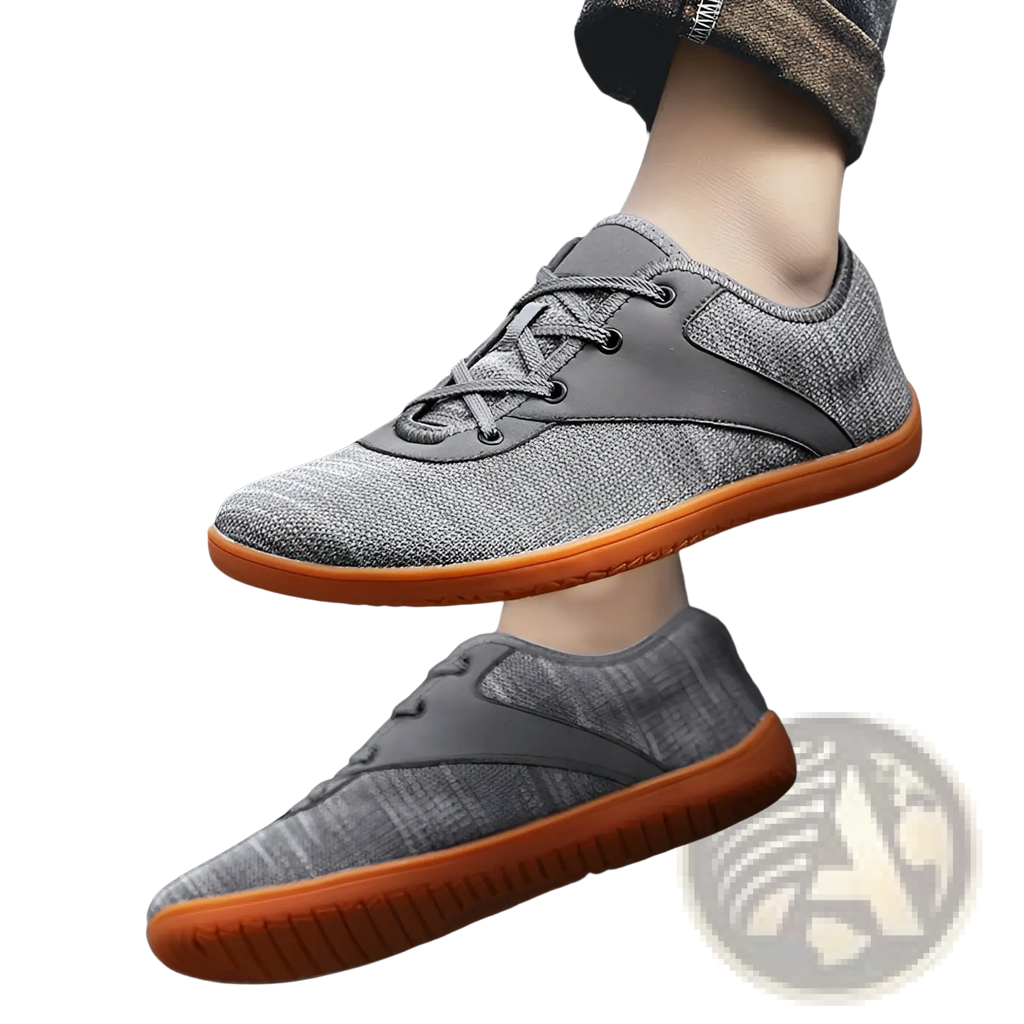 Men’s wide toe breathable mesh running sneakers in gray woven canvas with black laces and orange rubber sole
