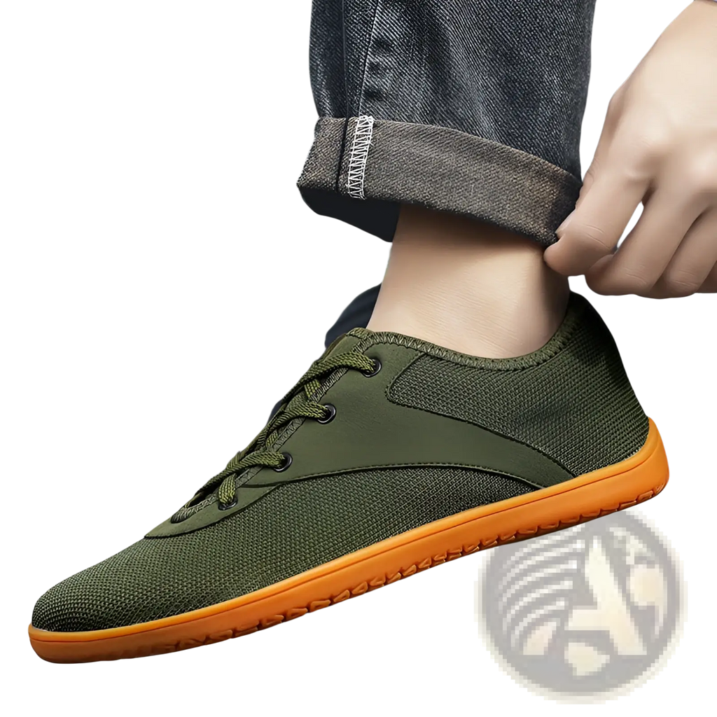 Men’s wide toe breathable mesh running sneakers in olive green with a vibrant orange rubber sole