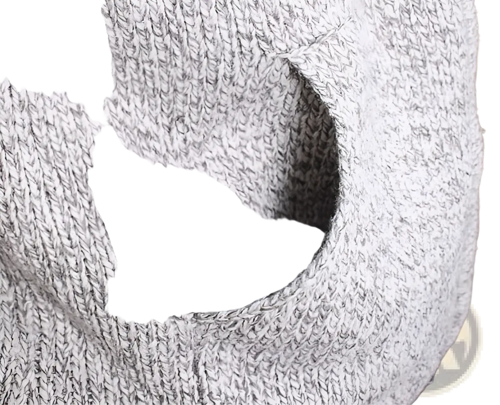 Close-up of a gray wool blend knit zip up hoodie showing textured fabric with a visible circular hole