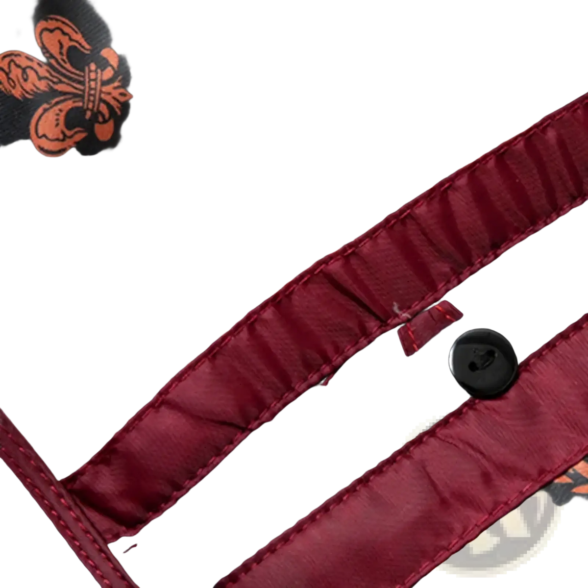 Men’s wool trench coat winter outerwear with black and burgundy fabric featuring ornate orange heraldic patterns