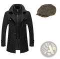 Men’s black woolen trench coat with high collar and front zipper paired with olive green tweed flat cap