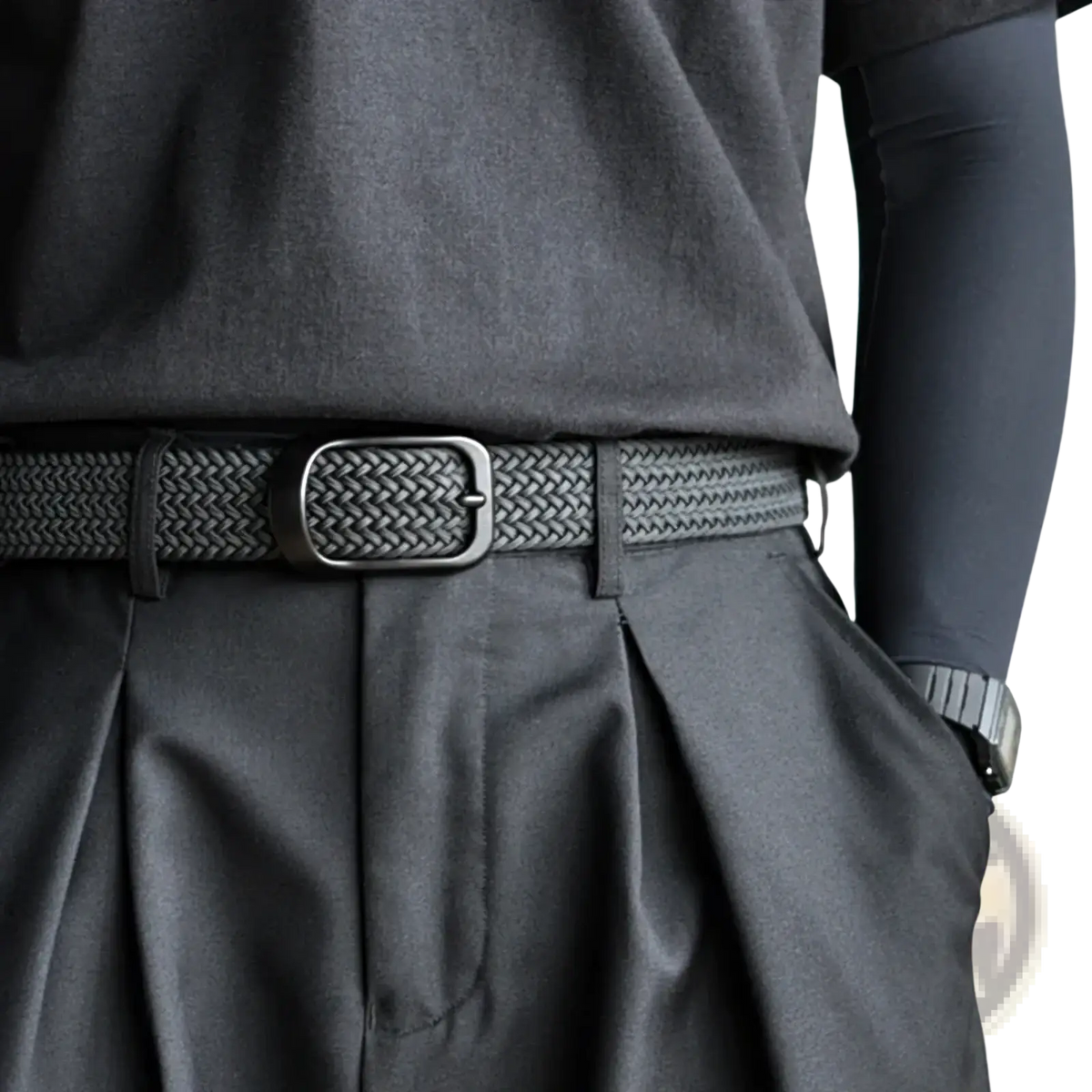 Black woven mens stretch belt with matte metal buckle made of casual canvas for golf and everyday wear