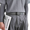 Gray woven stretch belt with black rectangular buckle made of casual canvas for mens golf and everyday wear