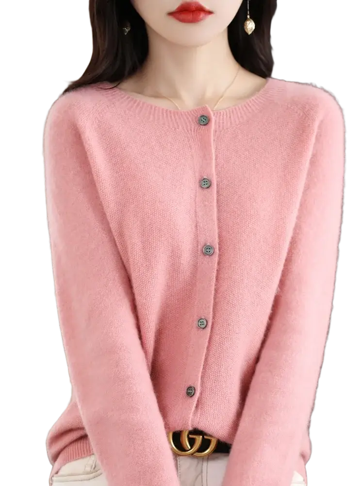 A soft pink merino wool cardigan for women with long sleeves dark gray buttons and a round neckline