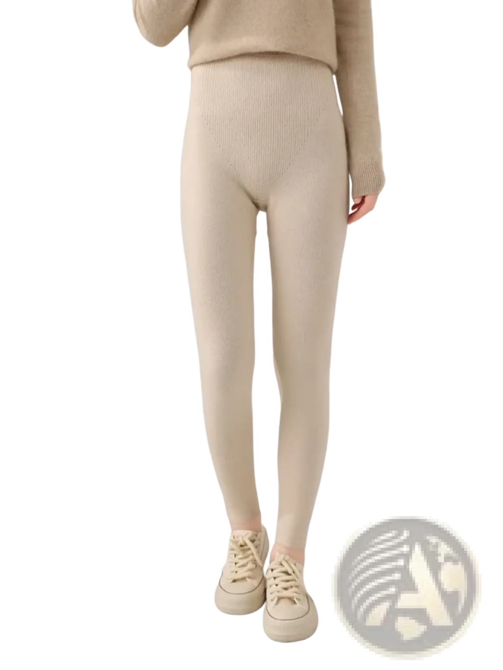 Cream-colored merino wool high waisted ribbed leggings showcasing a soft textured fabric and flattering fit