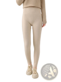 Cream-colored merino wool high waisted ribbed leggings showcasing a soft textured fabric and flattering fit