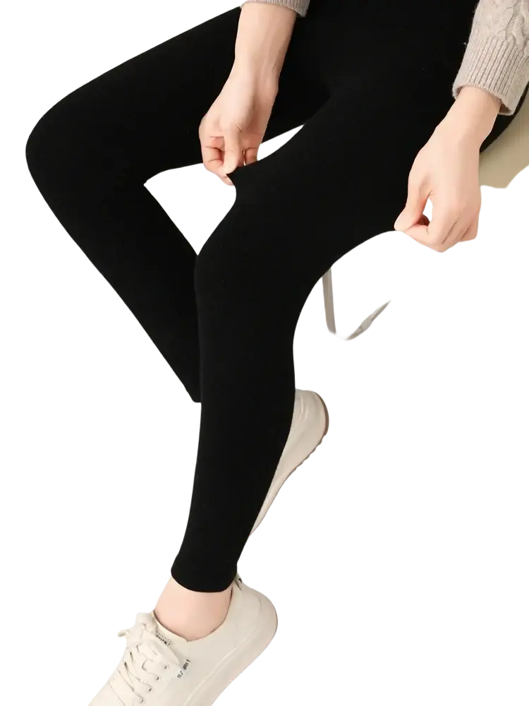 Black high waisted ribbed leggings made of stretchy merino wool fabric for comfortable form fitting wear