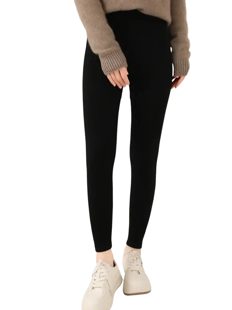 Black merino wool high waisted ribbed leggings made of smooth stretchy material with a form fitting design