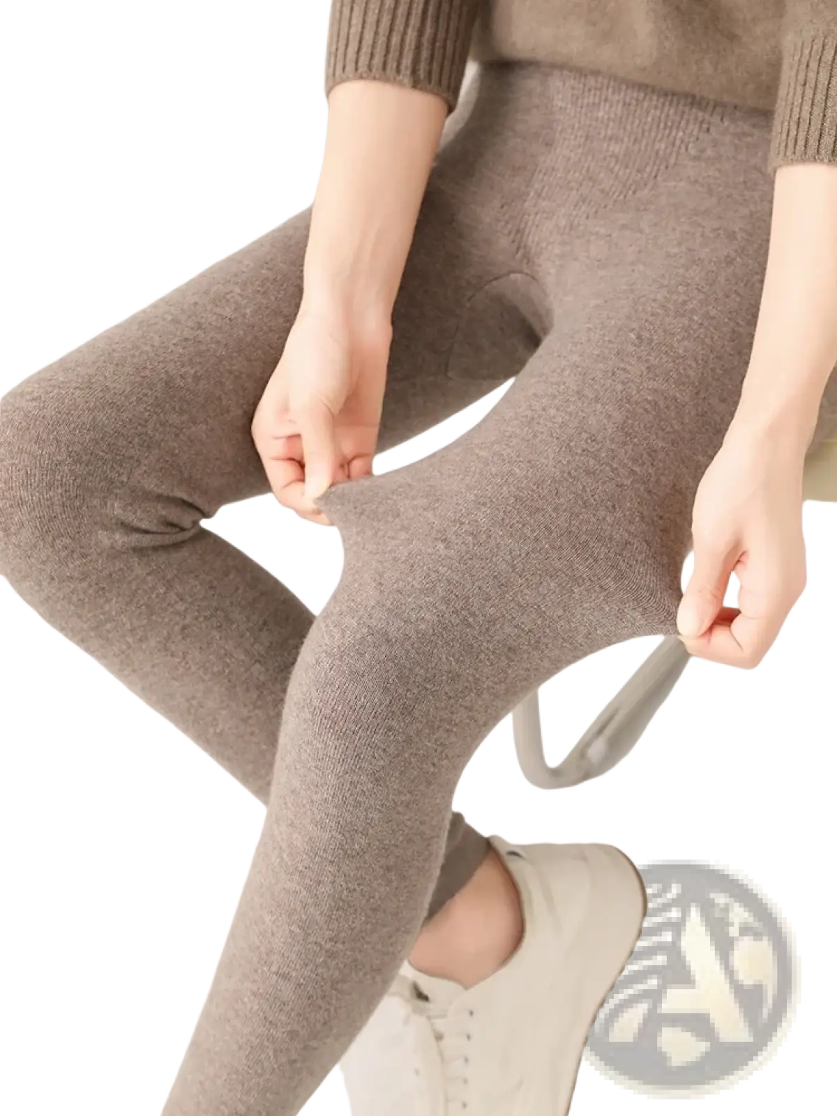Warm taupe merino wool high waisted leggings with a seamless design and ribbed cuff for comfortable wear