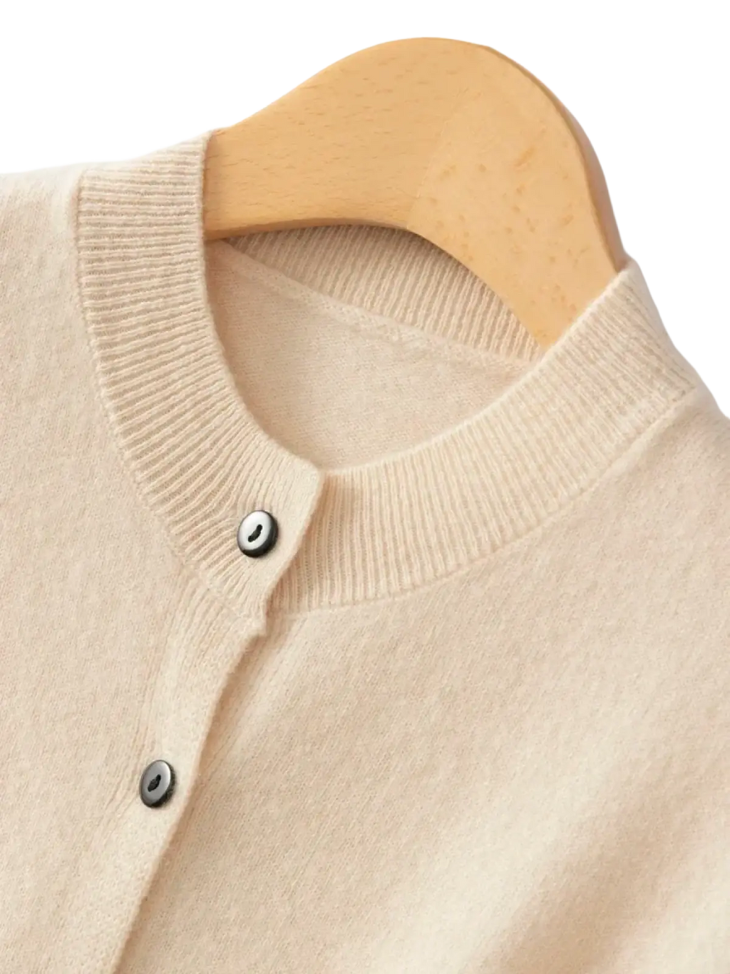Beige merino wool knit vest for women featuring a round neckline and silver buttons on a knit cardigan design