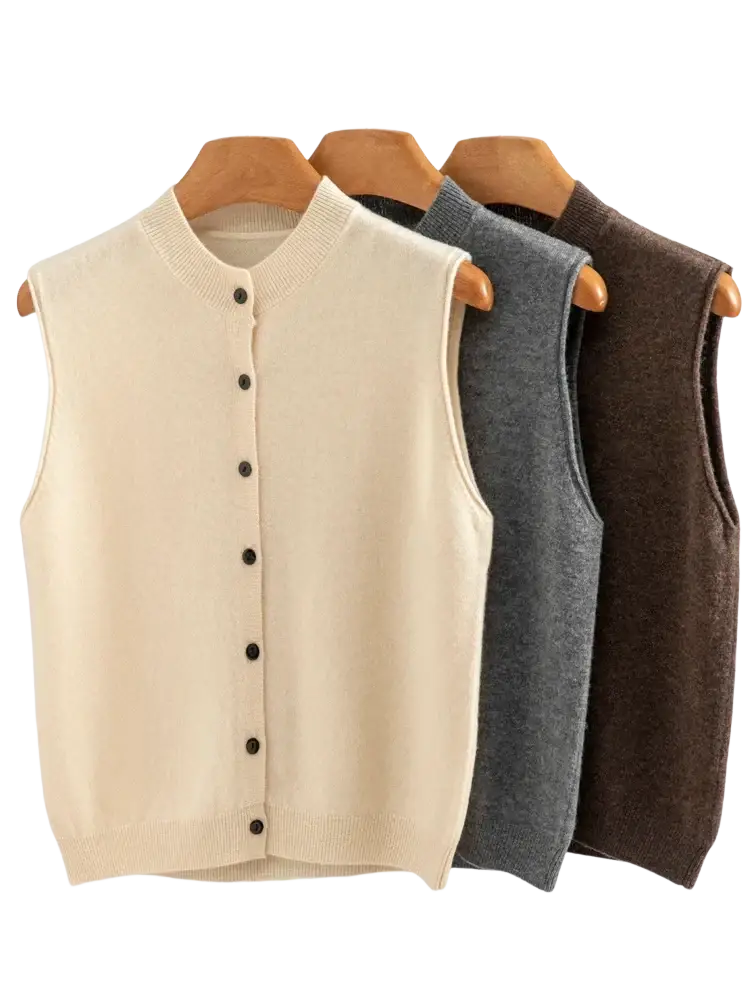 Cream-colored merino wool knit vest for women with black buttons and ribbed neckline, sleeveless design