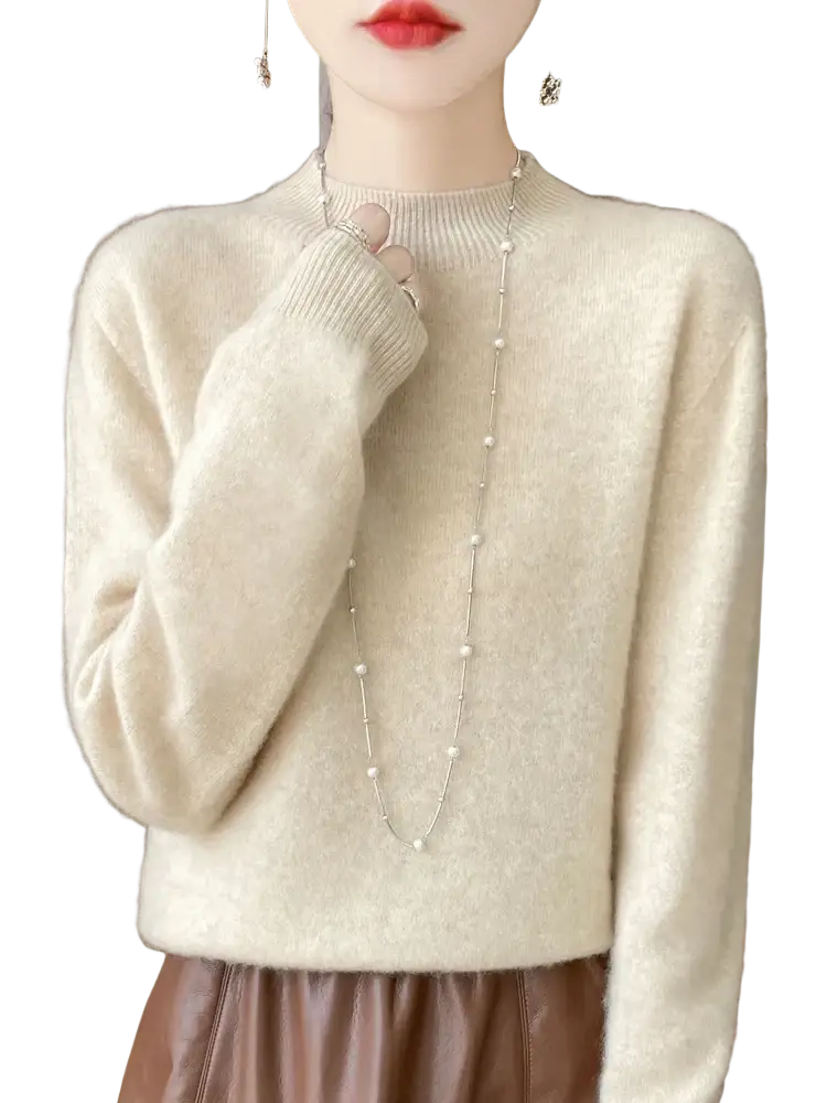 Cream-colored soft-textured merino wool pullover sweater for women with ribbed crew neckline and cuffs